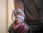 U.S. Navy Hospital Corpsman 1st Class Eric Adams, from Wildomar, California, performs a blood transfusion in a hangar bay onboard Marine Corps Base Kaneohe Bay, Oahu, Hawaii, in support of a joint-service medical training exercise during Rim of the Pacific (RIMPAC) 2022, July 26, 2022. Twenty-six nations, 38 ships, three submarines, more than 170 aircraft and 25,000 personnel are participating in RIMPAC from June 29 to Aug. 4 in and around the Hawaiian Islands and Southern California. The world's largest international maritime exercise, RIMPAC provides a unique training opportunity while fostering and sustaining cooperative relationships among participants critical to ensuring the safety of sea lanes and security on the world's oceans. RIMPAC 2022 is the 28th exercise in the series that began in 1971. (U.S. Navy photo by Mass Communication Specialist 2nd Class Brett McMinoway)