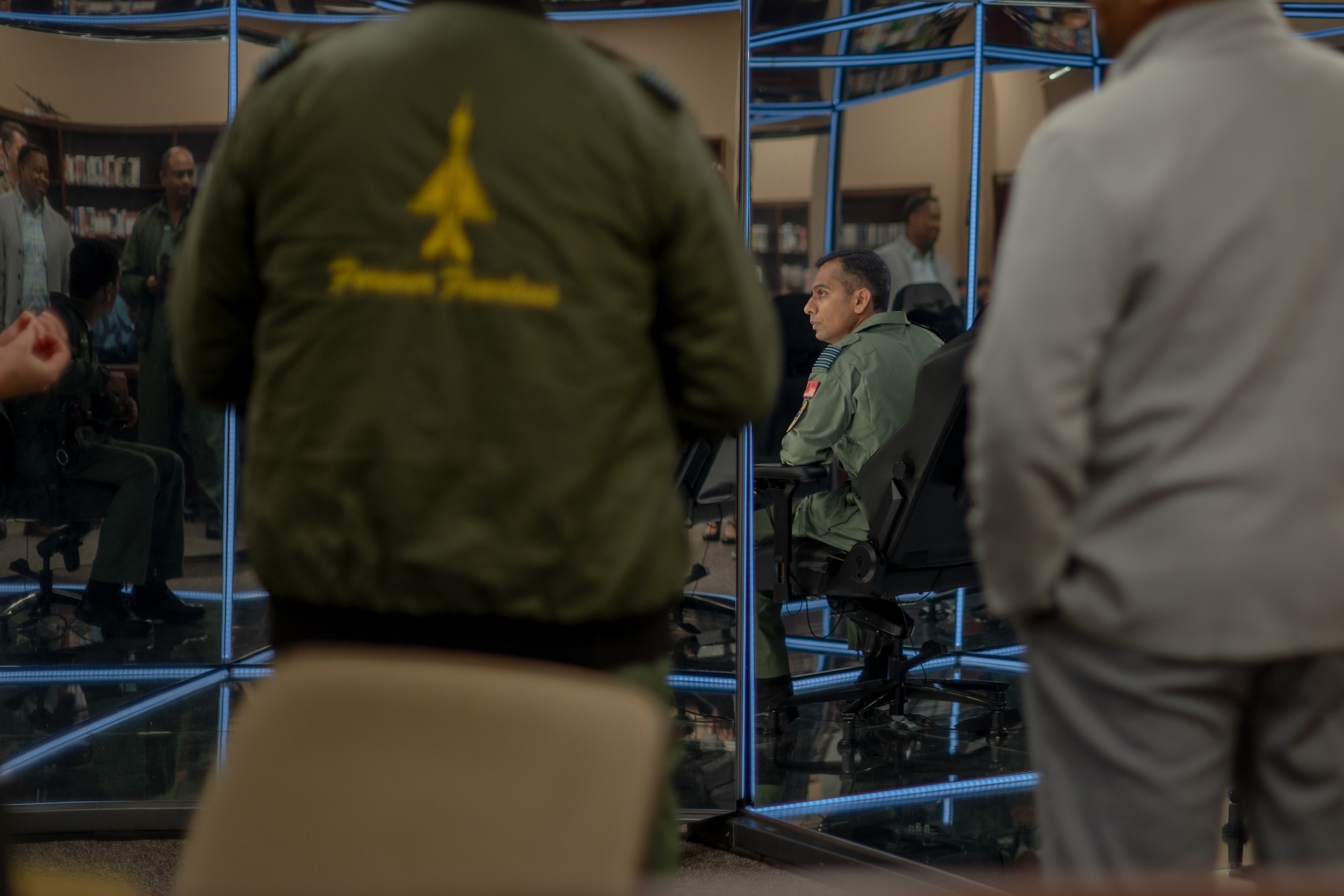 Members from the Indian Air Force gather around during a tour of the Air University Library.