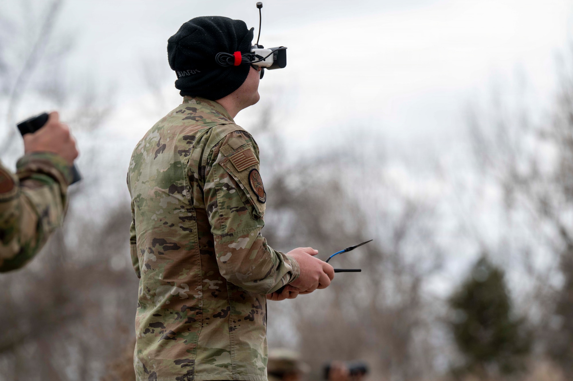 Senior Airman Reilly Stredde, 319th Aircraft Maintenance Squadron Point Defense Battle Lab small unmanned aerial system operator, flies a drone during an operational demonstration as part of a Point Defense Battle Lab ribbon cutting ceremony at Grand Forks Air Force Base, North Dakota, April 9, 2026.