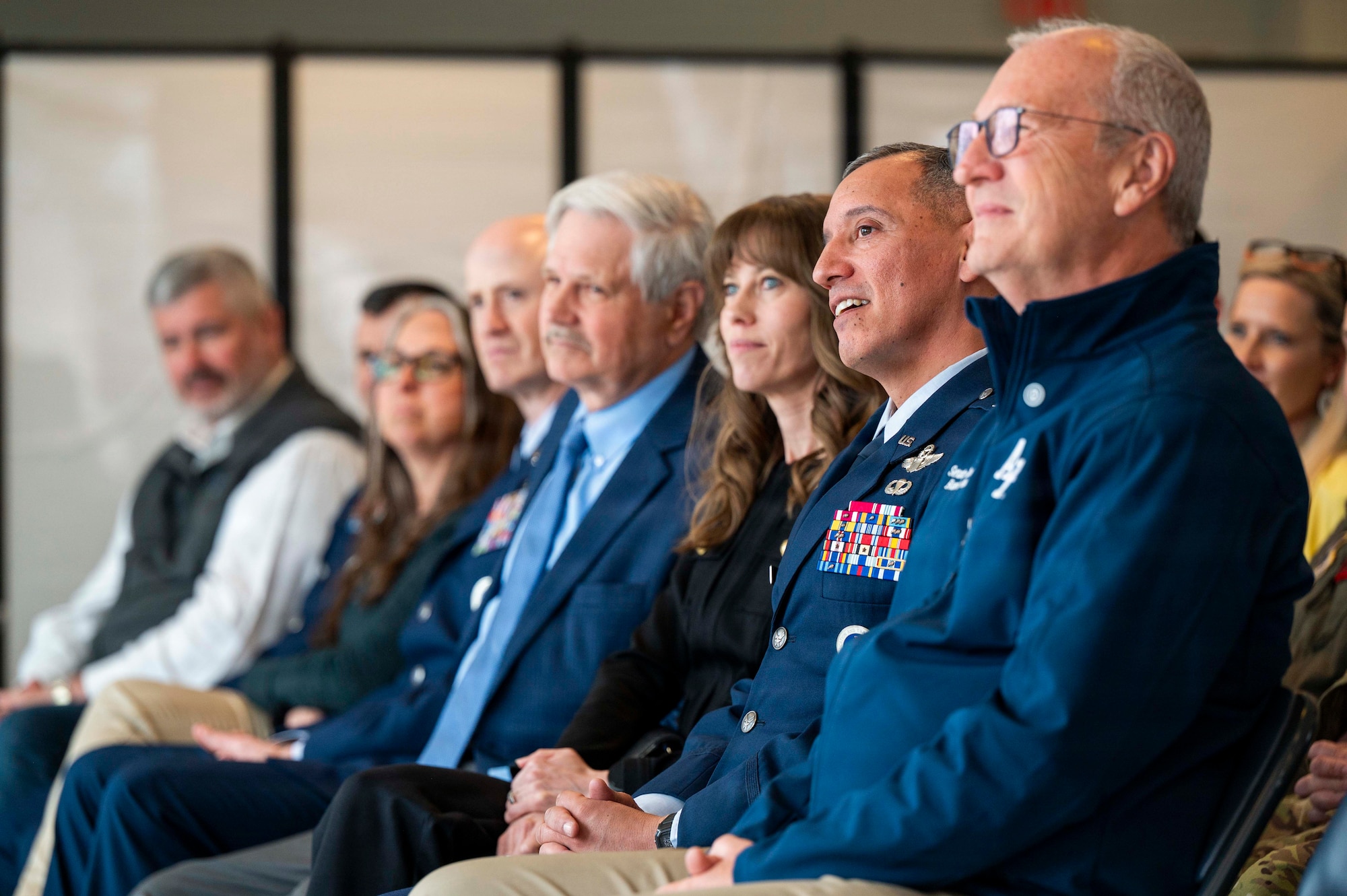 From right, Sen. Kevin Cramer, R-N.D.; Col. Alfred Rosales, 319th Reconnaissance Wing commander; Michaela Rosales, 319th RW commander spouse; Sen. John Hoeven, R-N.D. and Chief Master Sgt. William Gruenes, 319th RW command chief; listen to remarks during a Point Defense Battle Lab ribbon cutting ceremony at Grand Forks Air Force Base, North Dakota, April 9, 2026.