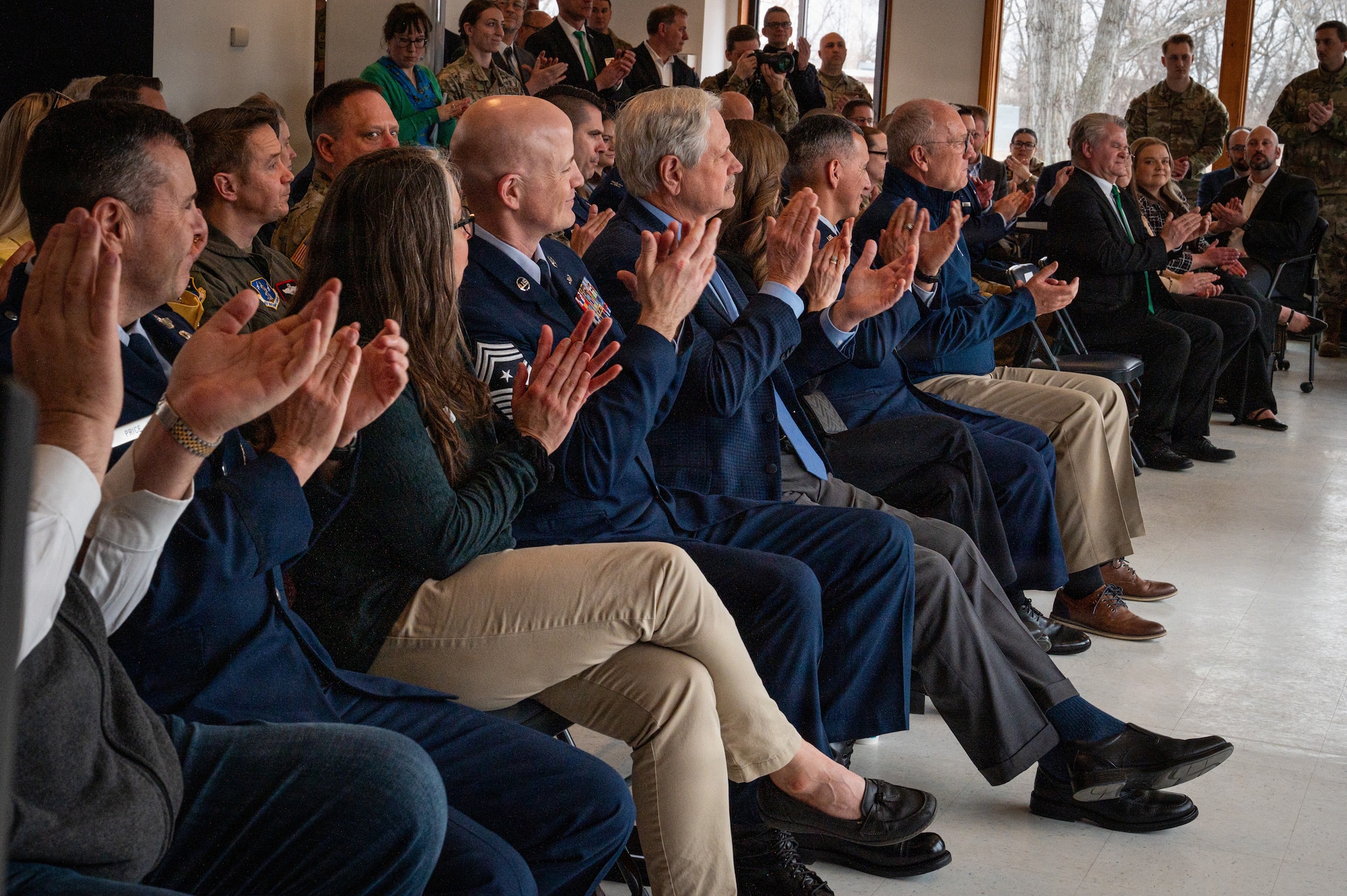 A crowd claps during a Point Defense Battle Lab ceremony at Grand Forks Air Force Base, North Dakota, April 9, 2026.