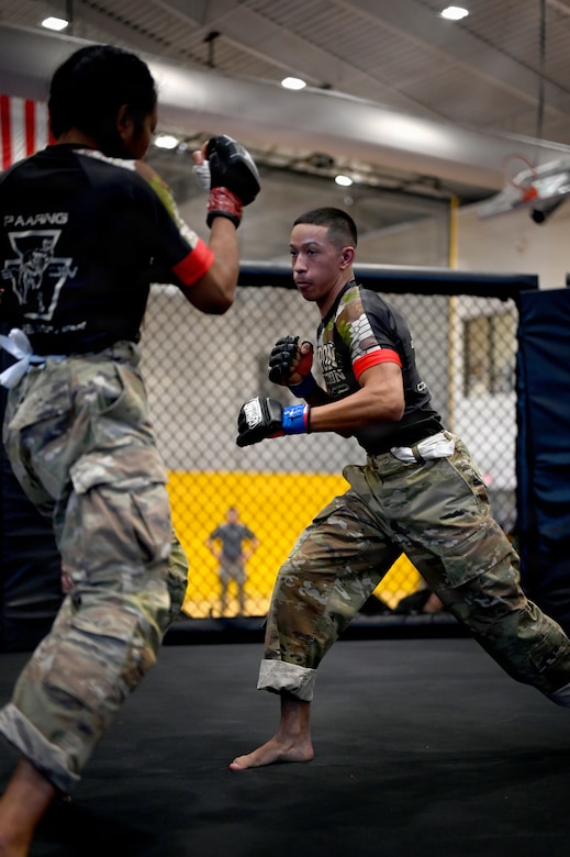 U.S. Army Spc. Isaiah Castellanos (right), District of Columbia National Guard, and Spc. Sandra Chheng, Pennsylvania Army National Guard, compete in the bantamweight finals during day three of the 2026 Lacerda Cup All-Army Combatives Championship at Fort Benning, Ga. Apr. 10, 2026. The two Army National Guard teams finished the tournament with third and sixth place team standings out of twenty-one teams competing, with three National Guard Soldiers earning championship belts. (U.S. Army National Guard photo by Sgt. 1st Class Shane Smith)