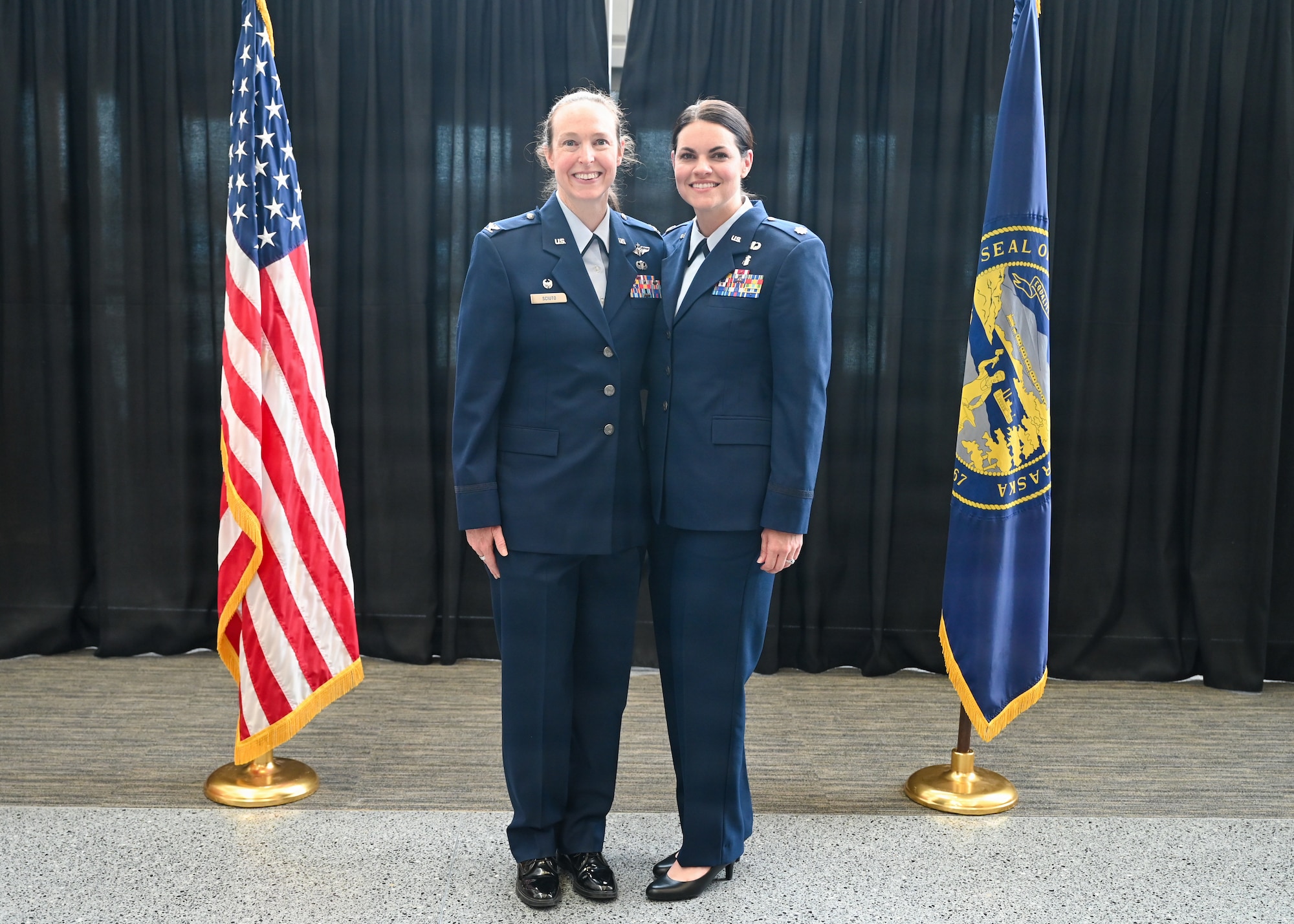 Col. Brooke Sciuto, outgoing 155th Medical Group commander, salutes Col. Christopher Hesse, 155th Air Refueling Wing commander, at her change of command ceremony, April 11, 2026, at the Nebraska National Guard air base in Lincoln, Nebraska. Sciuto thanked Hesse for his leadership and friendship over the past four years. (U.S. Air National Guard photo by Tech. Sgt. Phil Cowen)