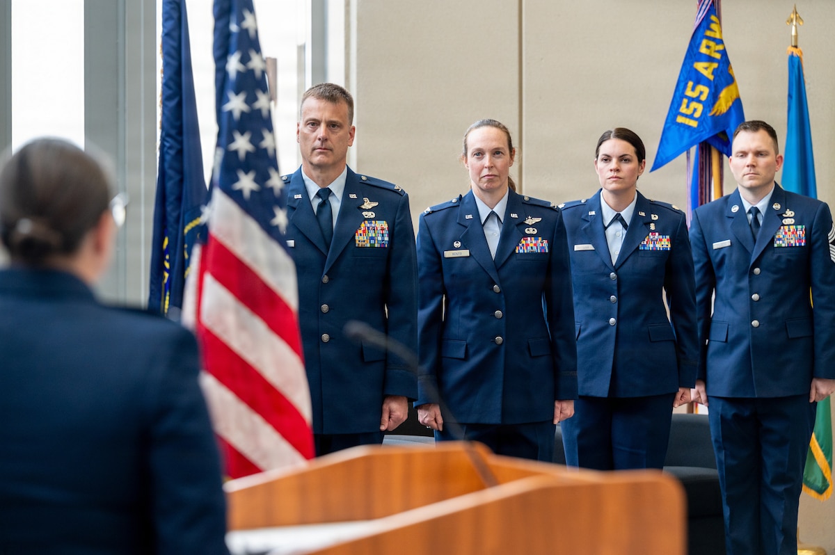 Col. Brooke Sciuto, outgoing 155th Medical Group commander, salutes Col. Christopher Hesse, 155th Air Refueling Wing commander, at her change of command ceremony, April 11, 2026, at the Nebraska National Guard air base in Lincoln, Nebraska. Sciuto thanked Hesse for his leadership and friendship over the past four years. (U.S. Air National Guard photo by Tech. Sgt. Phil Cowen)