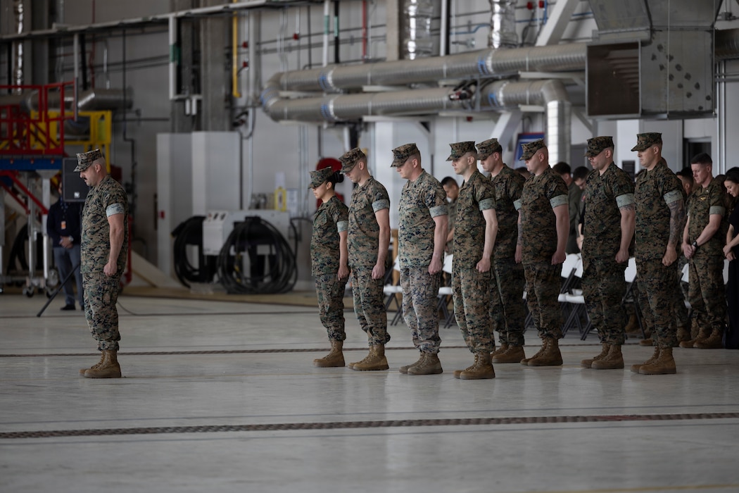 U.S. Marines with Marine Fighter Attack Squadron (VMFA) 251, Marine Aircraft Group 14, 2nd Marine Aircraft Wing, bow their heads during a relief and appointment ceremony at Marine Corps Air Station Cherry Point, North Carolina, April 1, 2026. The ceremony represented the transfer of responsibility, authority and accountability from Sgt. Maj. Ashley C. Harrod, from Kentucky, the outgoing command senior enlisted leader of VMFA-251, to Sgt. Maj. Iulian Dan, from Romania, the incoming command senior enlisted leader. (U.S. Marine Corps photo by Lance Cpl. Perri Wood)
