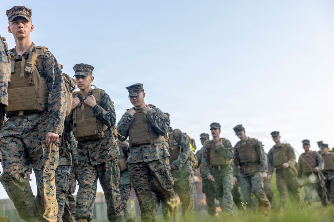 U.S. Marines and Sailors with Headquarters and Service Battalion, 2nd Marine Logistics Group, participate in a hike during a warrior festival at Marine Corps Base Camp Lejeune, North Carolina, April 2, 2026. H&S Battalion hosted the warrior festival to evoke friendly competition while raising camaraderie and espirit de corps for Marines and Sailors. (U.S. Marine Corps photo by Lance Cpl. Isabella Ramos)