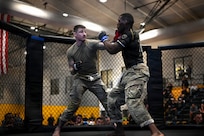 U.S. Army Sgt. Jeremiah Slagle (left), Ohio Army National Guard, competes in the finals during day three of the 2026 Lacerda Cup All-Army Combatives Championship at Fort Benning, Georgia, April 10, 2026.