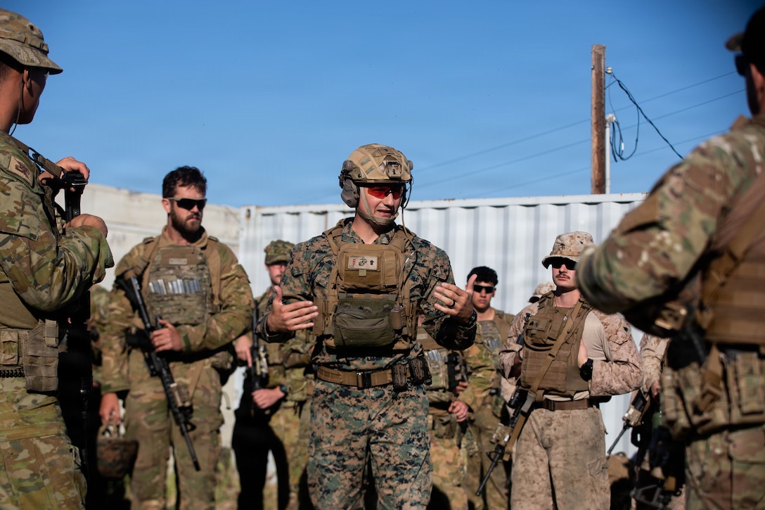 U.S. Marine Corps Chief Warrant Officer 2 Juan Inumerable, the battalion gunner of 4th Light Armored Reconnaissance Battalion, 4th Marine Division, gives a safety brief to Australian Defence Force  and New Zealand Defence Force service members, during a subject matter expert exchange at Marine Corps Base Camp Pendleton, California, March 20, 2026. During the exchange, Marines conducted live-fire drills with foreign partners on various marksmanship techniques increasing interoperability and combined capabilities between them. (U.S. Marine Corps photo by Cpl. Keegan Jones)