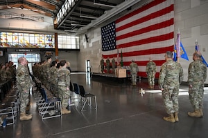 U.S. Airmen with the 143rd Cyberspace Operations Squadron and 194th Intelligence Squadron, Washington Air National Guard, stand at attention for “The Star-Spangled Banner” during their mobilization ceremony at Camp Murray, Wash., April 3, 2026.