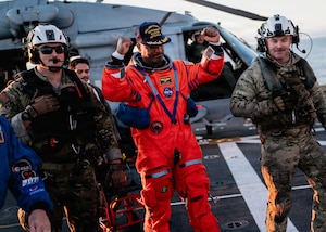 NASA astronaut Victor Glover celebrates on the flight deck of the San Antonio Class amphibious transport dock USS John P. Murtha (LPD 26) after returning from space on Apr. 10, 2026. John P. Murtha is underway in the U.S. 3rd Fleet area of operations supporting NASA’s Artemis II mission, retrieving the crew and spacecraft following their return to Earth and splashdown in the Pacific Ocean. NASA’s Artemis II mission sent four astronauts on a flight around the moon in the Orion space craft, marking the first time humans journeyed to deep space in over 50 years. (U.S. Navy photo by Mass Communication Specialist 2nd Class August Clawson)