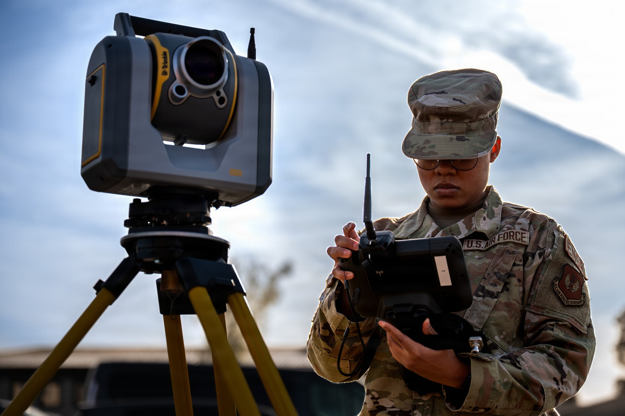U.S. Air Force Airman 1st Class Neveah Gordon, 86th Civil Engineer Squadron geo base apprentice, reads data from surveying Trimble SX12 at Ramstein Air Base, Germany, April 9, 2026.