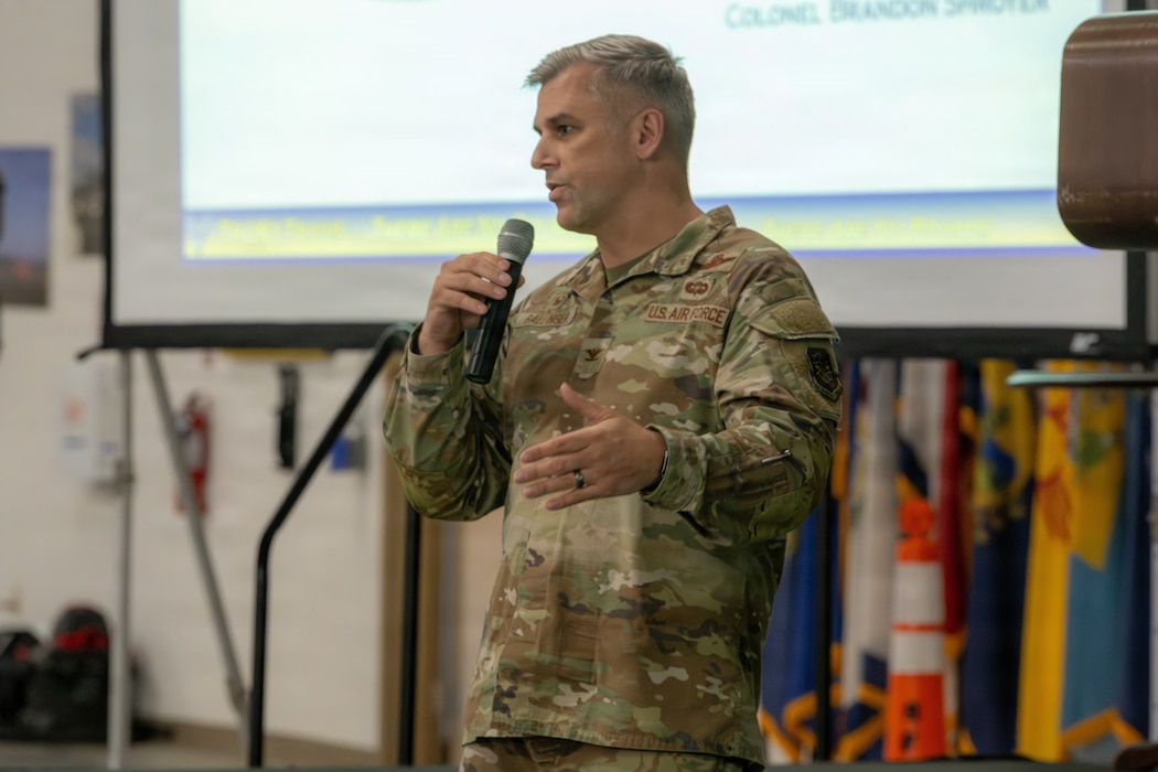 An Air Force Colonel speaks at the Honorary Commander immersion tour.