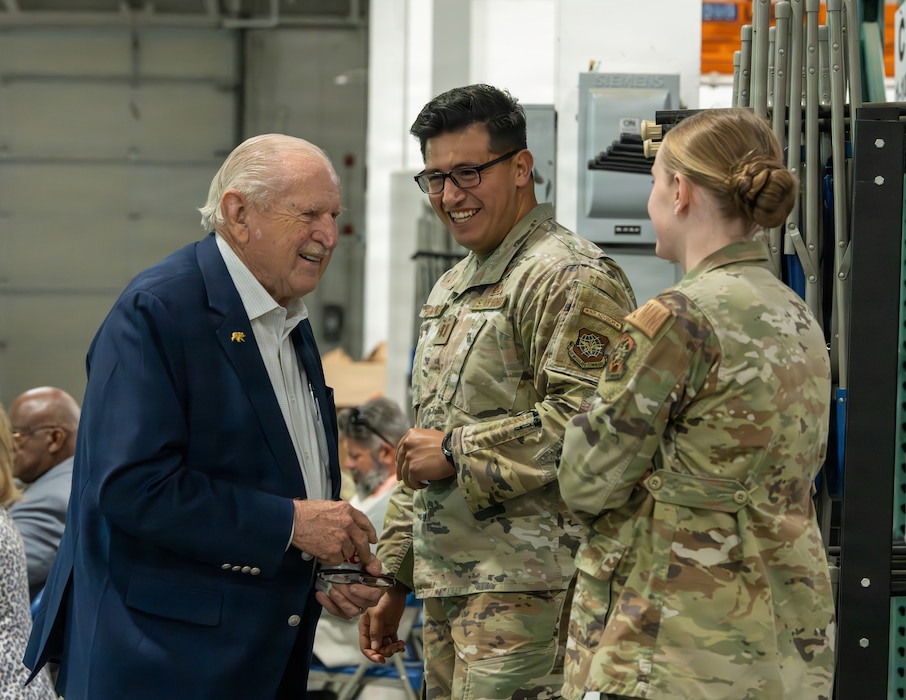 A Travis Golden Bear speaks with Airmen.