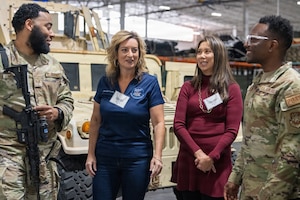 Honorary Commanders speak with Airmen.