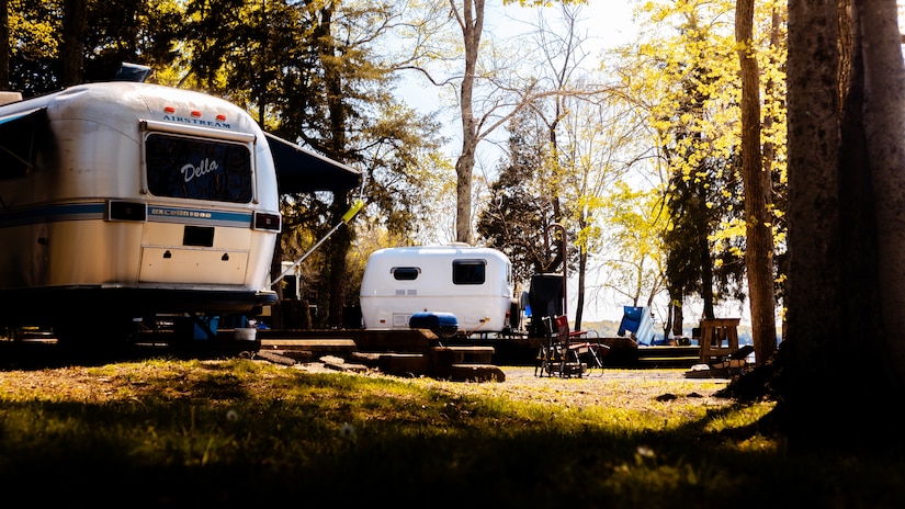 Recreational trailers sit nestled among trees at Seven Points Campground on the shoreline of J. Percy Priest Lake in Hermitage, Tennessee. The campsite is an awesome home base for recreation where visitors can relax and take advantage of activities such as hiking, swimming, and boating. Corps campgrounds offer great amenities such as bathrooms with showers, electric and water hookups, dump stations, laundry rooms, playgrounds, and boat ramps.  (USACE Photo by Christopher Grissett)