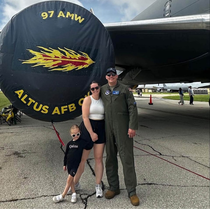 U.S. Air Force Maj. Jeremy Delzer, 56th Air Refueling Squadron KC-46 Pegasus aircraft instructor pilot and demo team lead, poses for a photo with his wife, Stephanie Delzer, Sexual Assault Prevention and Response victim advocate, and his daughter in front of a KC-46 at the Sheppard Air Force Base Airshow, Wichita Falls, Texas, April, 28, 2024. Stationed in Altus, Jeremy has had the opportunity to serve as a KC-46 instructor pilot and raise his children close to their grandparents, creating a life where service and family support each other. (Courtesy photo)