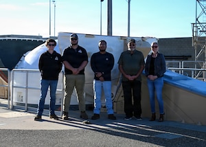 Members of the Virginia Spaceport Authority pose for a group photo during a visit to a Ground Based Interceptor site at Vandenberg Space Force Base.