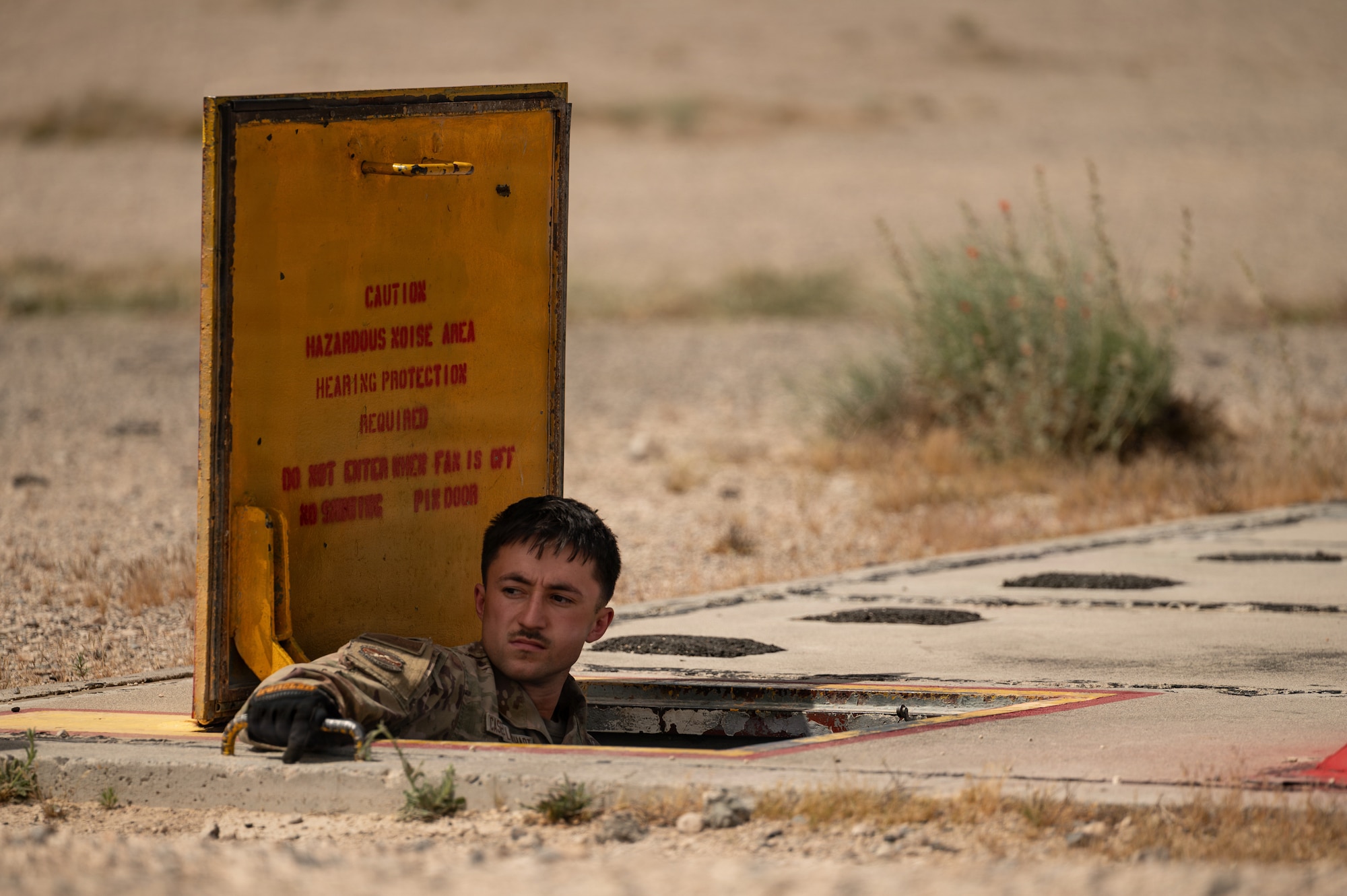 person stands in hole in ground