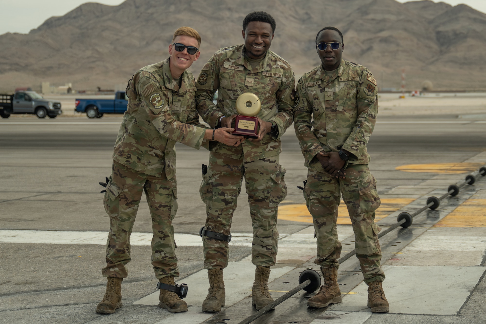 people stand with trophy