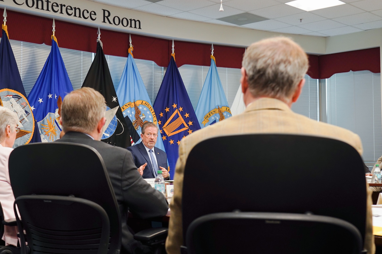 leaders briefing around table