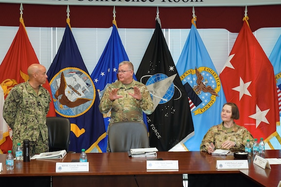 leaders briefing around table