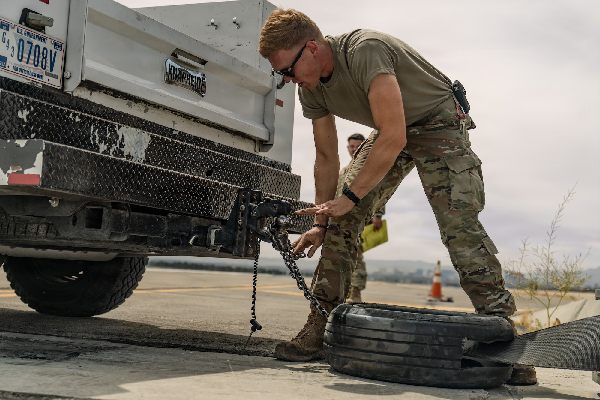 person pulls chain on truck