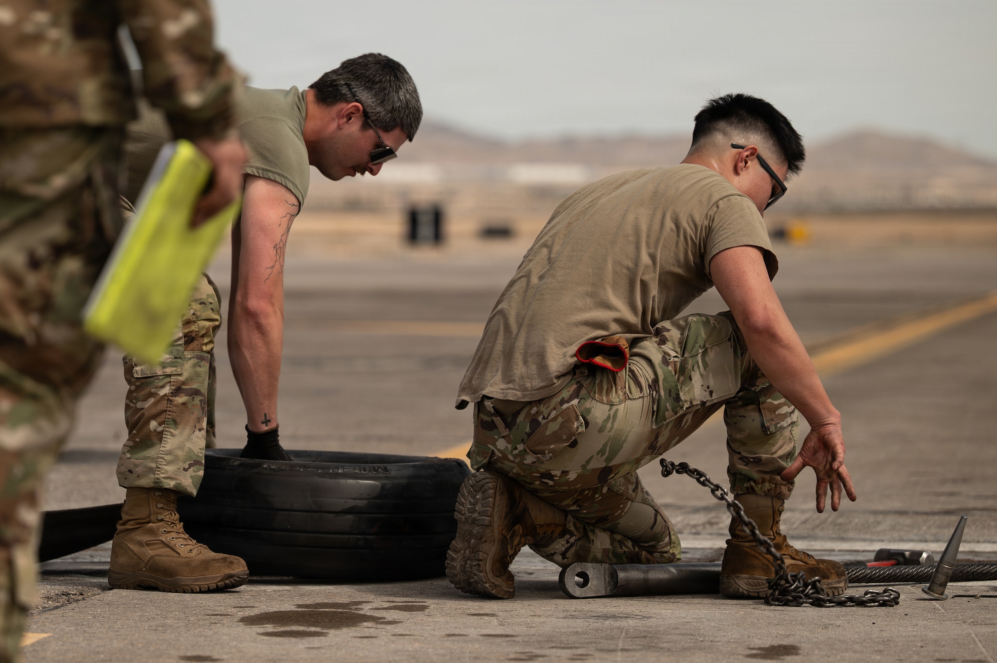 people crouched on ground
