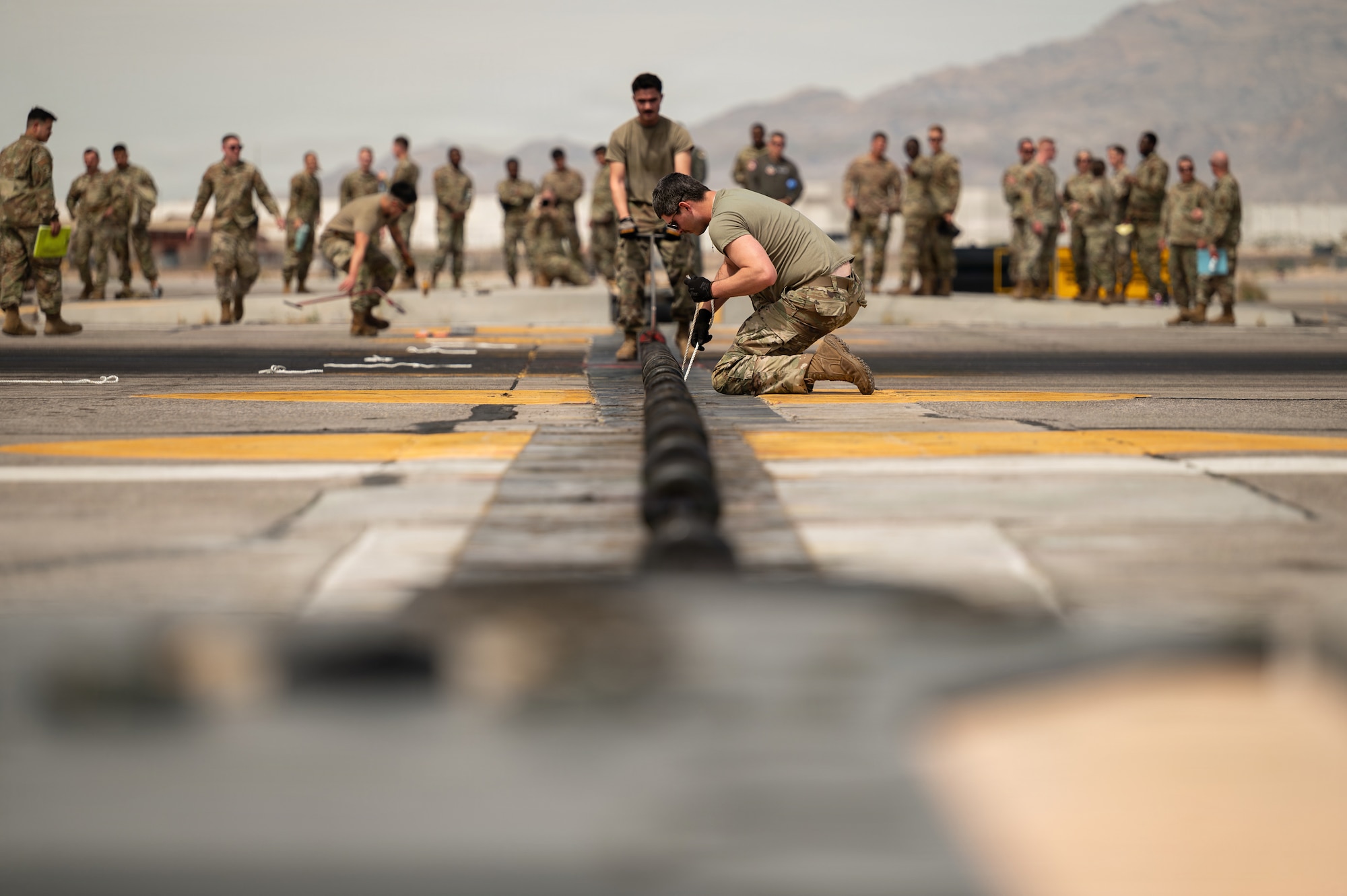 people crouch on ground