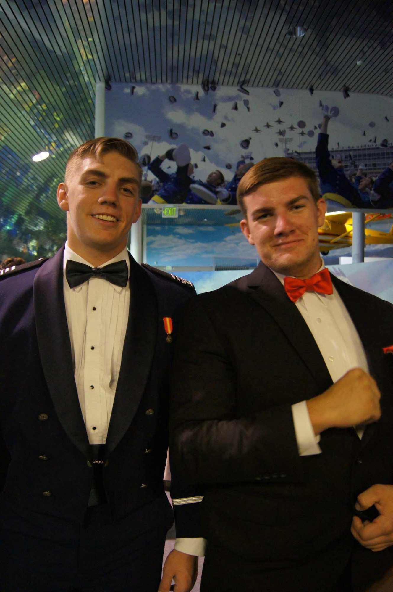 Then, U.S. Air Force Cadet Capt. Jeremy Delzer, left, and his brother, Johnathan Delzer, right, pose for a photo at the U.S. Air Force Academy, Colorado Springs, Colorado, in May of 2015. Jeremy, now a KC-46 Pegasus aircraft instructor pilot and demo lead in the 56th Air Refueling Squadron, and Johnathan, now a KC-46 electrician in the 97th Maintenance Group, represent two halves of the same mission, execution and preparation, both essential and interconnected. (Courtesy photo)
