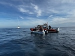 A Coast Guard boarding team assigned to the 87-foot Marine Protector-Class Coast Guard Cutter Narwhal (WPB-87335) conducts a boarding of a suspected alien-smuggling vessel near Point Loma, California, April 9, 2026. During the boarding, three suspected aliens were identified, all claiming Mexican nationality. (U.S. Coast Guard courtesy photo)