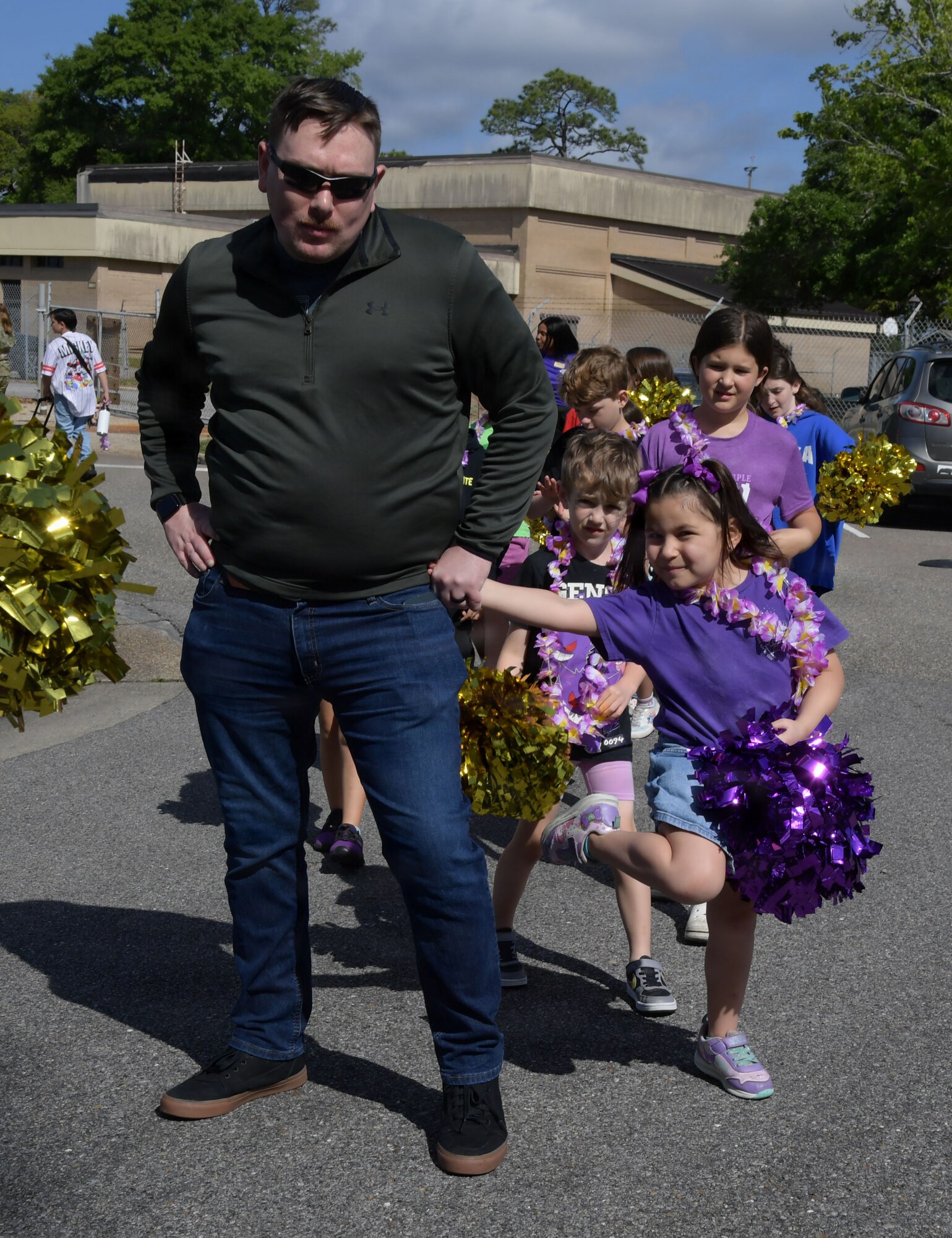 A man and little girl strike a pose for the camera.