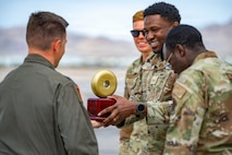 People holding trophy