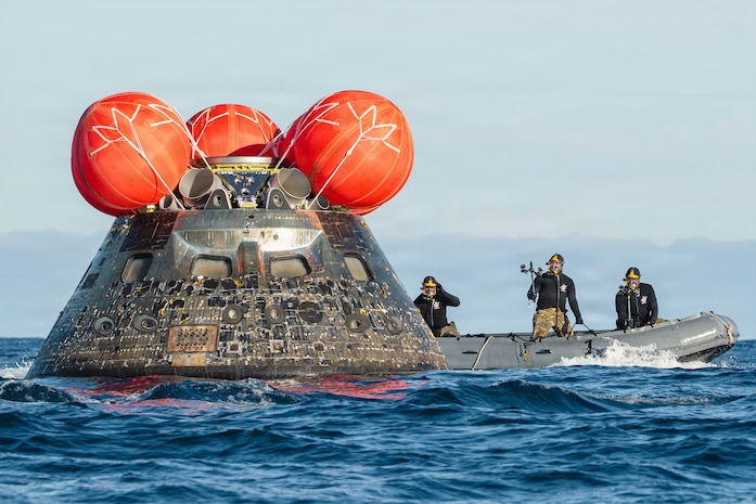 U.S. Navy divers, attached to Explosive Ordnance Disposal Group (EODGRU) 1, conduct a hazardous material detection sweep of the Artemis II crew module after its return from its lunar mission on April 10, 2026.