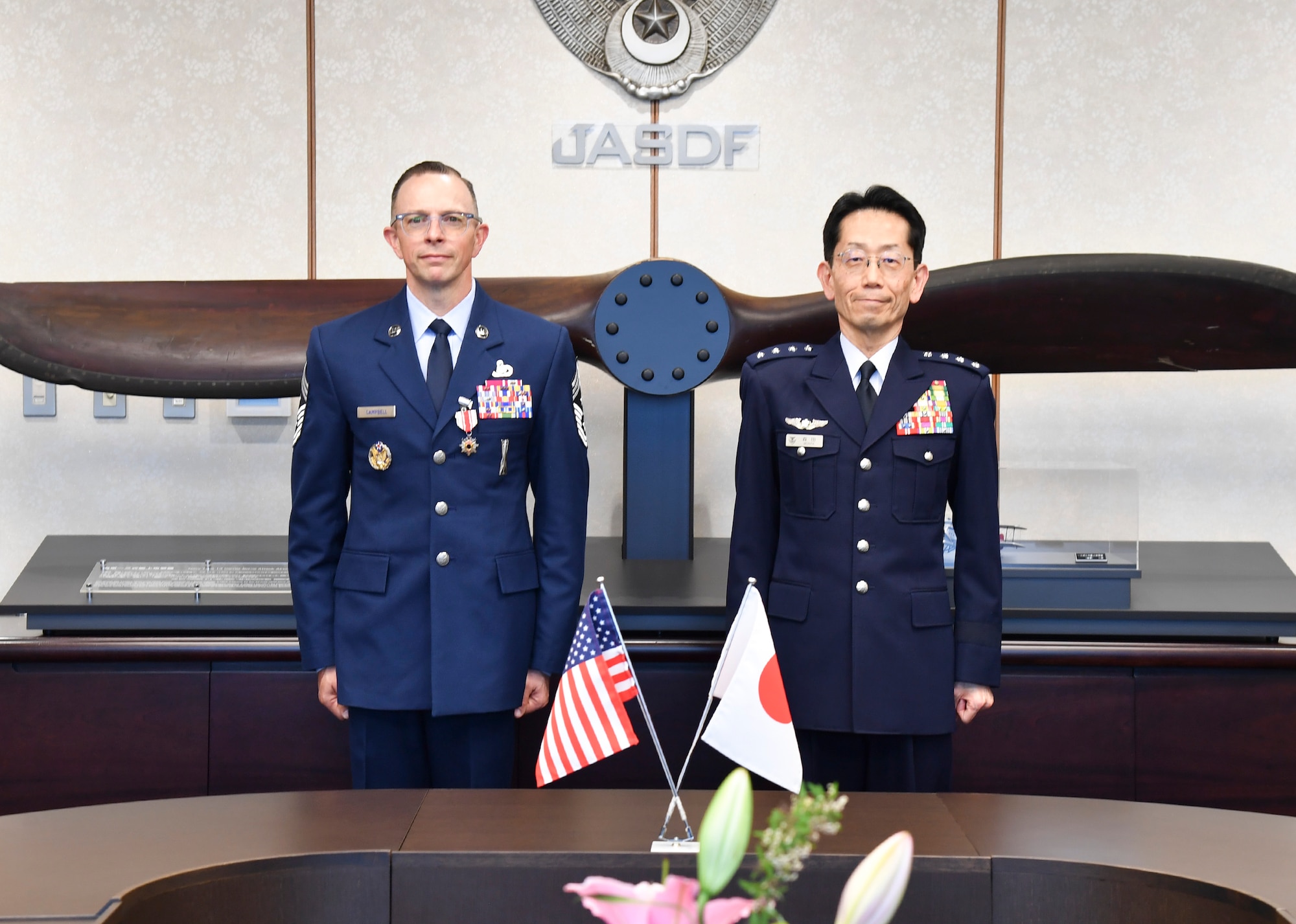 U.S. Air Force Chief Master Sergeant Shaun Campbell and Japan Air Self-Defense Force Gen Takehiro Morita pose for a photo at the Ministry of Defense Tokyo, Japan, April 10, 2026. Campbell received the Certificate of Appreciation, Japan Defense Cooperation Award 2nd Class for his contributions to strengthening the relationship and interoperability between between Koku-Jieitai (Japan Air Self-Defense
Force) and the United States Air Force.