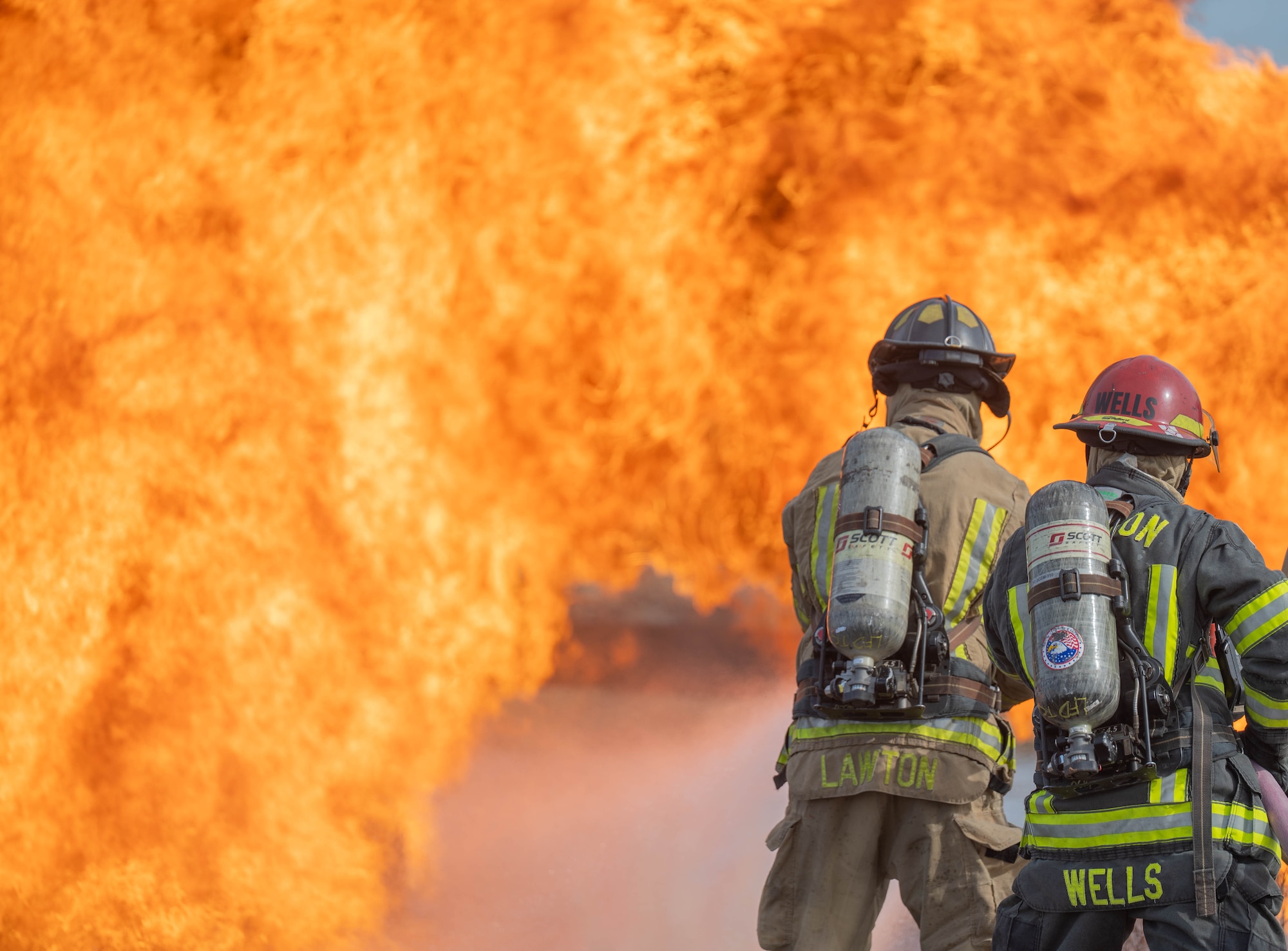 Members of the Altus Air Force Base (AFB) Fire Department and Lawton Fire Department participate in a live fire training at Altus Air Force Base, Oklahoma, April 7, 2026. This joint training strengthened the long-standing partnership between the Altus AFB Fire Department and the Lawton Fire Department. (U.S. Air Force photo by Airman 1st Class Emma Wright)