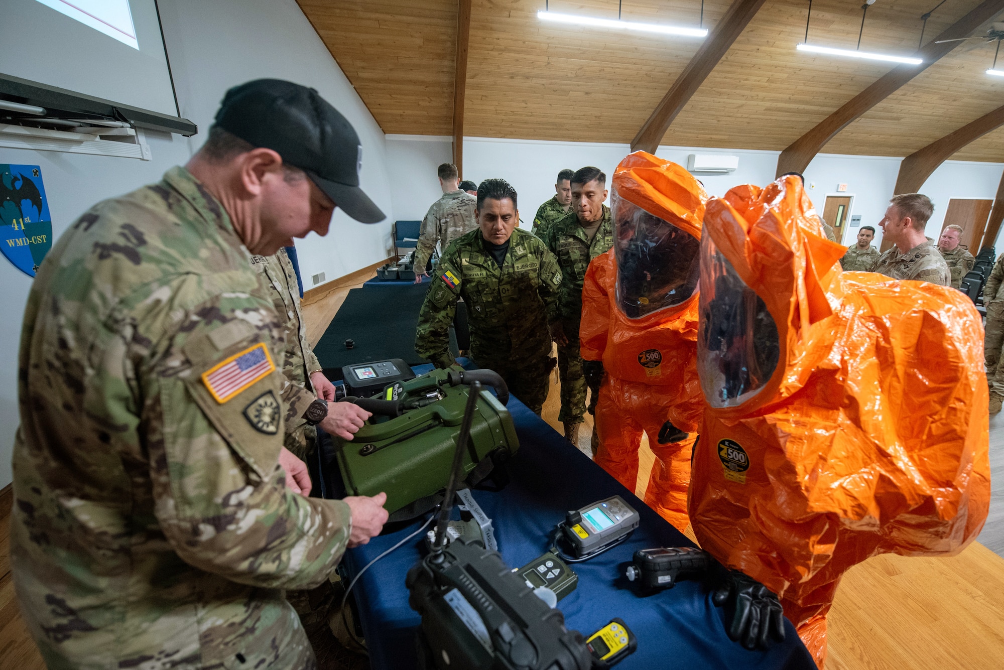 A U.S. Army soldier from the Kentucky National Guard’s 41st Weapons of Mass Destruction Civil Support Team demonstrates equipment used to test for hazardous airborne isotopes for members of the Ecuadorian military at the Kentucky Air National Guard base in Louisville, Ky., March 9, 2026. The Ecuadorians were visiting as part of the National Guard Bureau State Partnership Program to learn more about the Kentucky Guard’s emergency-response capabilities and interagency cooperation across the state, and to share their own techniques for responding to emergency contingencies. (U.S. Air National Guard photo by Phil Speck)