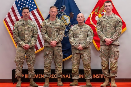 (Left to right) Sgt. 1st Class Ryan Herb, Sgt. 1st Class Erich Friedlein, Command Sgt. Maj. Oscar Laughman, and Spc. Peter Wenzel pose for a photo at the Pennsylvania Army National Guard State Best Warrior Competition awards ceremony April 12, 2026, at Fort Indiantown Gap, Pa. (Pennsylvania National Guard photo by Sgt. Tristan Murry)