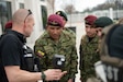 Members of the Ecuadorian military examine a forward-looking infrared radiation isotope detector while observing an emergency-response training scenario involving airmen and soldiers from the Kentucky National Guard’s 41st Weapons of Mass Destruction Civil Support Team and civilian emergency responders at Churchill Downs Racetrack in Louisville, Ky., March 10, 2026. The Ecuadorians were visiting as part of the National Guard Bureau State Partnership Program to learn more about the Kentucky Guard’s emergency-response capabilities and interagency cooperation across the state, and to share their own techniques for responding to emergency contingencies. (U.S. Air National Guard photo by Phil Speck)
