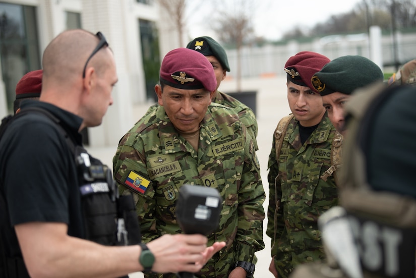 Members of the Ecuadorian military examine a forward-looking infrared radiation isotope detector while observing an emergency-response training scenario involving airmen and soldiers from the Kentucky National Guard’s 41st Weapons of Mass Destruction Civil Support Team and civilian emergency responders at Churchill Downs Racetrack in Louisville, Ky., March 10, 2026. The Ecuadorians were visiting as part of the National Guard Bureau State Partnership Program to learn more about the Kentucky Guard’s emergency-response capabilities and interagency cooperation across the state, and to share their own techniques for responding to emergency contingencies. (U.S. Air National Guard photo by Phil Speck)