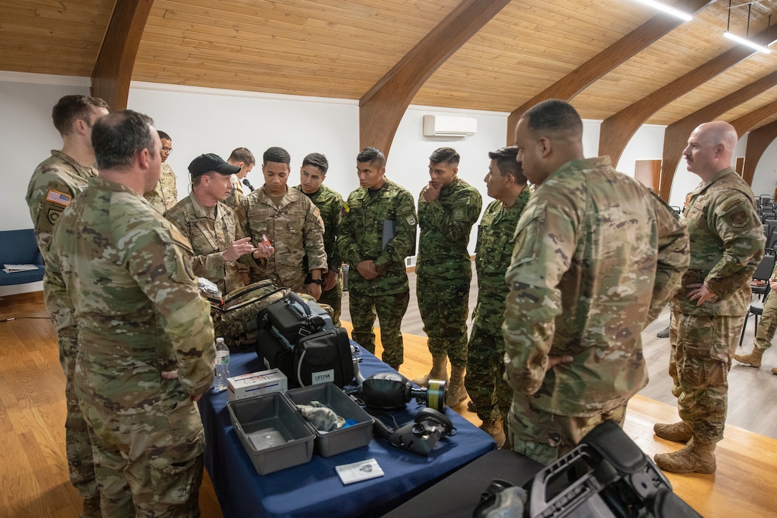 Airmen and soldiers from the Kentucky National Guard’s 41st Weapons of Mass Destruction Civil Support Team demonstrate life-saving equipment for members of the Ecuadorian military at the Kentucky Air National Guard base in Louisville, Ky., March 9, 2026. The Ecuadorians were visiting as part of the National Guard Bureau State Partnership Program to learn more about the Kentucky Guard’s emergency-response capabilities and interagency cooperation across the state, and to share their own techniques for responding to emergency contingencies. (U.S. Air National Guard photo by Phil Speck)