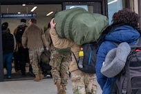 Simulated evacuees assigned to U.S. Forces Korea conduct in-processing during a simulated Non-combatant Evacuation Operation during exercise Freedom Shield 26 (FS26) at Yokota Air Base, Japan, March 10, 2026.