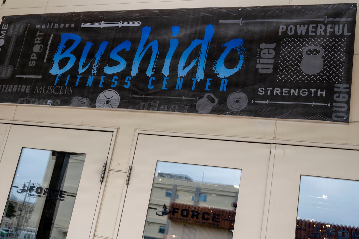 A banner marks the entrance to the Bushido Fitness Center during its grand opening at Misawa Air Base, Japan, April 10, 2026. The new fitness facility supports the 35th Force Support Squadron’s effort to expand workout options and maintain fitness access across the installation during renovations to the Potter Fitness Center. (U.S. Air Force photo by Senior Airman Gavin Hameed)