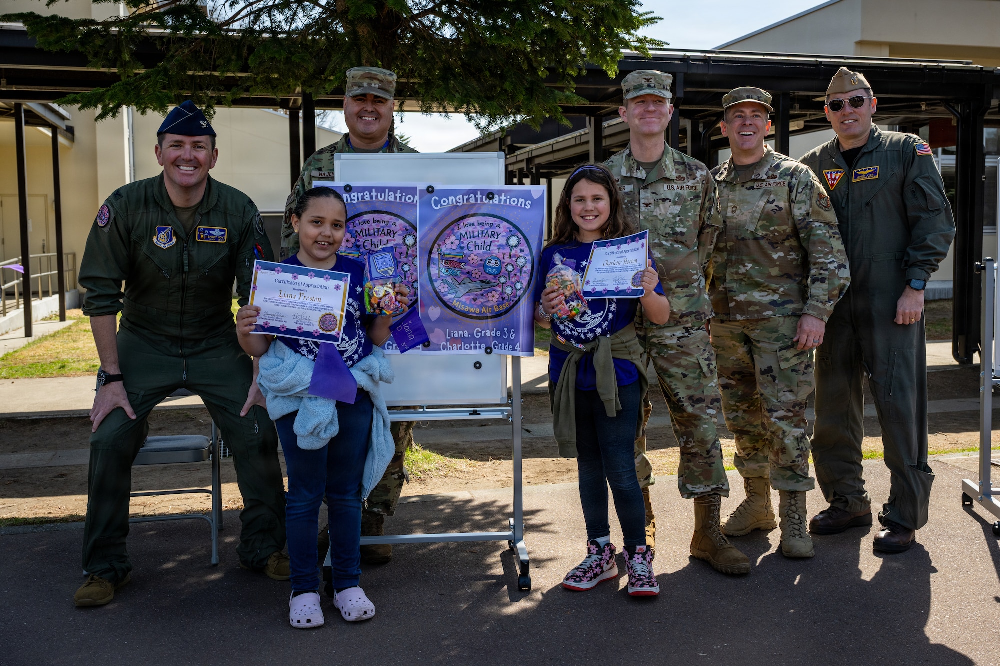 35th Fighter Wing and Naval Air Facility Misawa leadership present a certificate of appreciation to Sollars Elementary School children during the Month of the Military proclamation ceremony at Misawa Air Base, Japan, April 10, 2026.