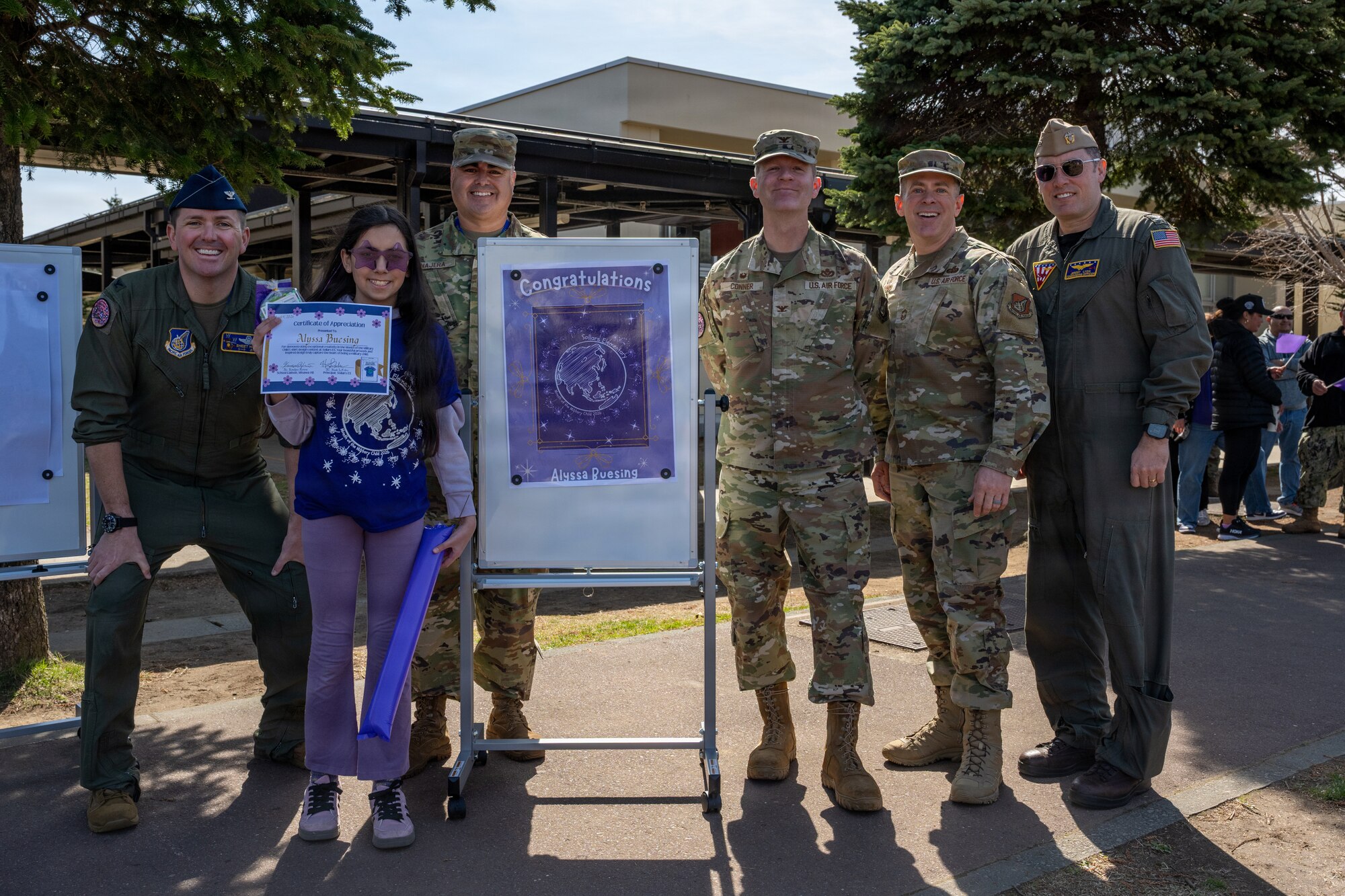 35th Fighter Wing and Naval Air Facility Misawa leadership present a certificate of appreciation to Sollars Elementary School children during the Month of the Military Child proclamation ceremony at Misawa Air Base