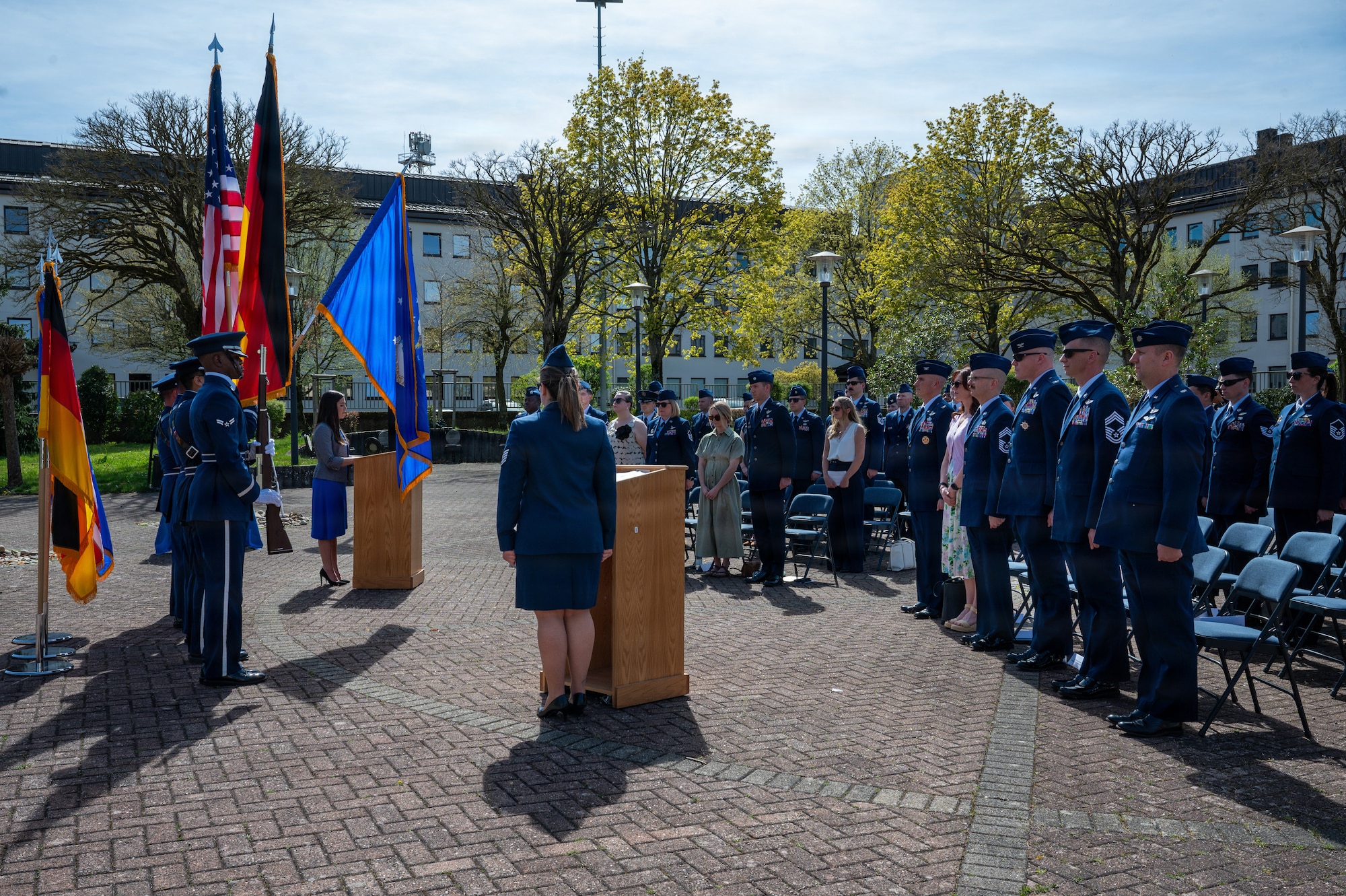 People stand at a memorial