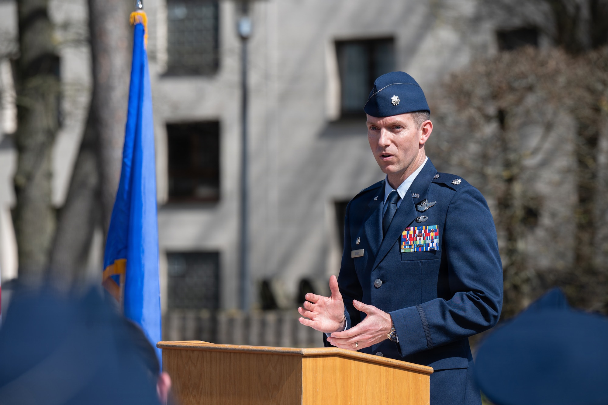 A man speaks at a podium for a memorial