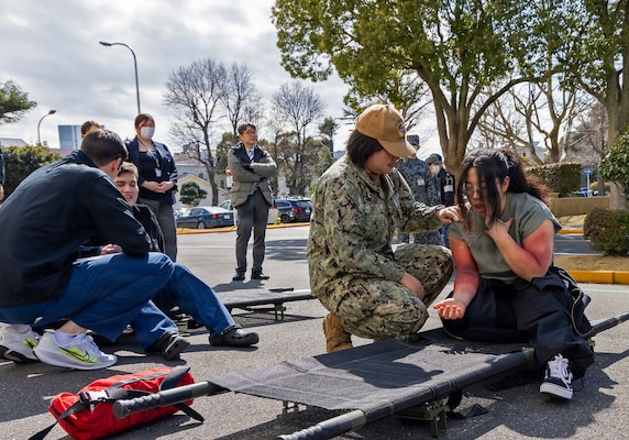 YOKOSUKA, Japan (March 11, 2026) — U.S. Naval Hospital (USNH) Yokosuka responders provide care to simulated casualties during a bilateral mass casualty drill at USNH Yokosuka. The scenario emphasized rapid assessment, communication, and prioritization of care in a high-stress environment. USNH Yokosuka and Japan Self-Defense Force (JSDF) Hospital Yokosuka conducted the drill to enhance joint medical response capabilities and lifesaving procedures in support of a free and open Indo-Pacific. (U.S. Navy photo by Daniel Taylor/U.S. Naval Hospital Yokosuka Public Affairs)