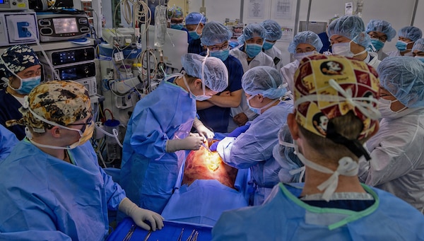 YOKOSUKA, Japan (March 11, 2026) — U.S. Naval Hospital (USNH) Yokosuka and Japan Self-Defense Force (JSDF) Hospital Yokosuka medical personnel conduct simulated surgical procedures using a “cut suit” training system during a bilateral mass casualty drill at USNH Yokosuka. The wearable simulator replicates complex trauma injuries, allowing teams to practice incision, hemorrhage control, and coordinated surgical response in a realistic environment. USNH Yokosuka and JSDF Hospital Yokosuka conducted the drill to enhance joint medical response capabilities and lifesaving procedures in support of a free and open Indo-Pacific. (U.S. Navy photo by Daniel Taylor/U.S. Naval Hospital Yokosuka Public Affairs)