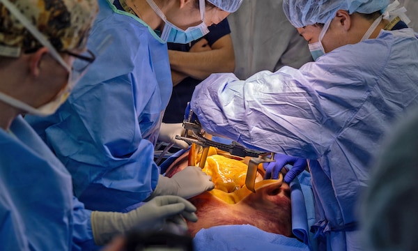 YOKOSUKA, Japan (March 11, 2026) — U.S. Naval Hospital (USNH) Yokosuka and Japan Self-Defense Force (JSDF) Hospital Yokosuka medical personnel conduct simulated surgical procedures using a “cut suit” training system during a bilateral mass casualty drill at USNH Yokosuka. The wearable simulator replicates complex trauma injuries, allowing teams to practice incision, hemorrhage control, and coordinated surgical response in a realistic environment. USNH Yokosuka and JSDF Hospital Yokosuka conducted the drill to enhance joint medical response capabilities and lifesaving procedures in support of a free and open Indo-Pacific. (U.S. Navy photo by Daniel Taylor/U.S. Naval Hospital Yokosuka Public Affairs)