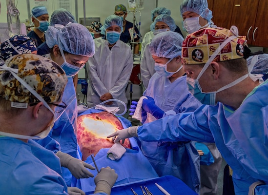 YOKOSUKA, Japan (March 11, 2026) — U.S. Naval Hospital (USNH) Yokosuka and Japan Self-Defense Force (JSDF) Hospital Yokosuka medical personnel conduct simulated surgical procedures using a “cut suit” training system during a bilateral mass casualty drill at USNH Yokosuka. The wearable simulator replicates complex trauma injuries, allowing teams to practice incision, hemorrhage control, and coordinated surgical response in a realistic environment. USNH Yokosuka and JSDF Hospital Yokosuka conducted the drill to enhance joint medical response capabilities and lifesaving procedures in support of a free and open Indo-Pacific. (U.S. Navy photo by Daniel Taylor/U.S. Naval Hospital Yokosuka Public Affairs)